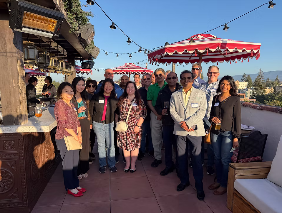 Phello members gathered at a rooftop regional event